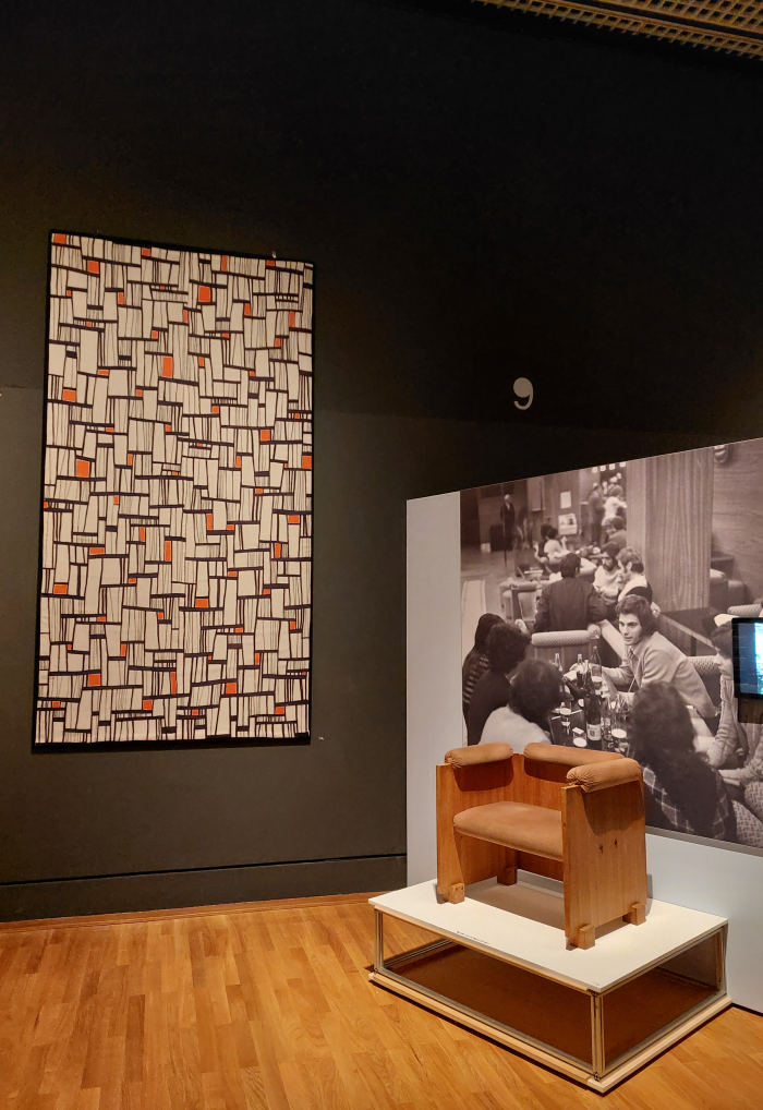 Sándor Mikó’s 1969 chair for the Te + Én espresso bar in Budapest, next to a curtain design by Irén Bódy, as seen at Retrotopia. Design for Socialist Spaces at the Kunstgewerbemuseum, Berlin